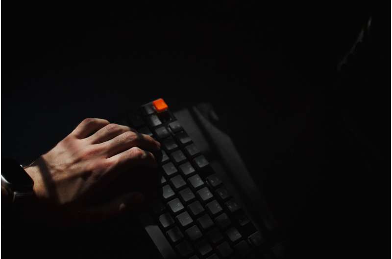 typing computer dark