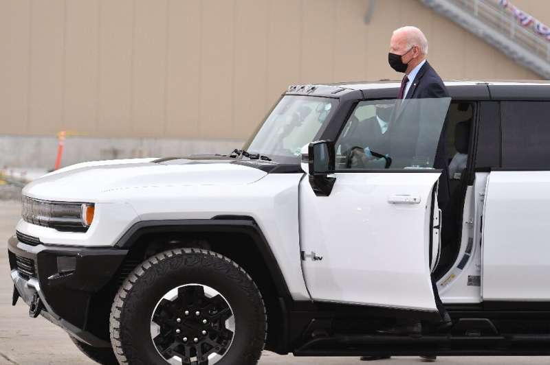 US President Joe Biden, shown here in November 2021 beside a GMC Hummer EV, has embraced the large electric trucks that dominate