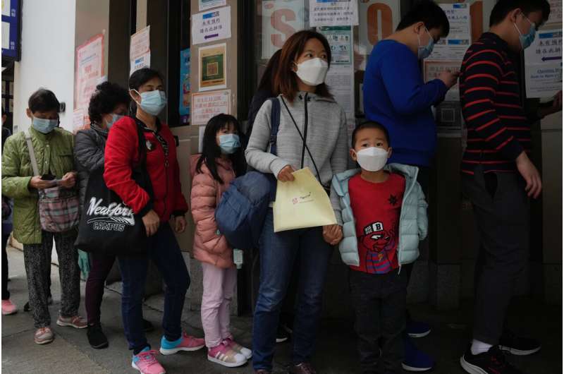 Virus surge begins to overwhelm Hong Kong's COVID measures