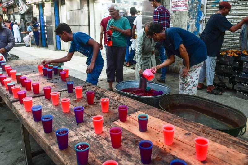 Volunteers in Karachi prepare Rooh Afza, a sweet beverage widely consumed during Islam's holy month of Ramadan