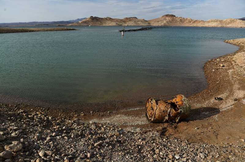Water levels have plummeted at Lake Mead  due to the American West's historic drought, exposing corroded barrels