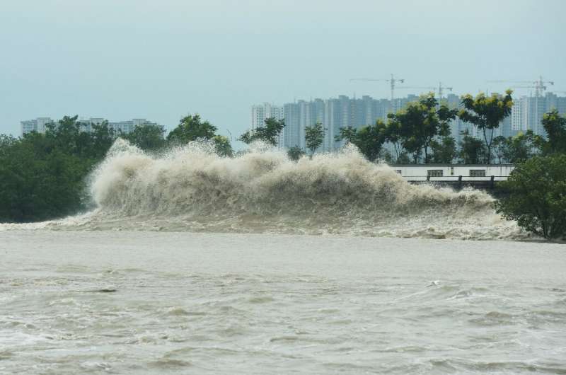 Waves generated by Typhoon Muifa break along the coast in Hangzhou in China's eastern Zhejiang province on September 14, 2022