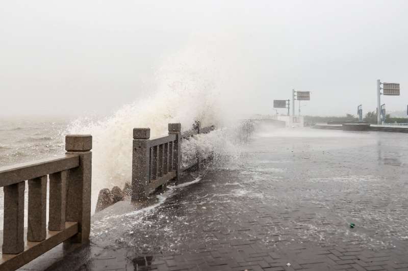 Waves generated by Typhoon Muifa break along the coast in Lianyungang in China's eastern Jiangsu province