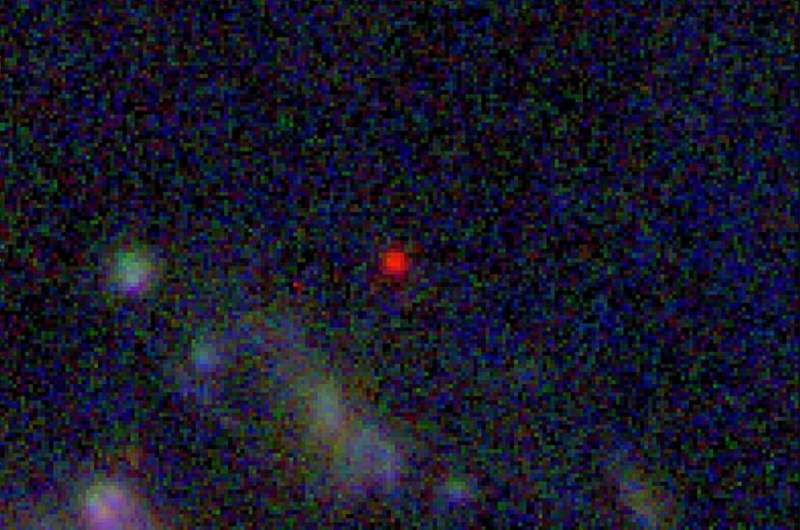 When translated from infrared into the visible spectrum, the galaxy appears as a blob of red with white in its center as part of