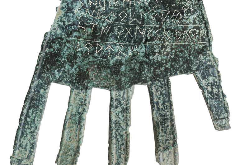 Words on bronze hand may rewrite past of Basque language
