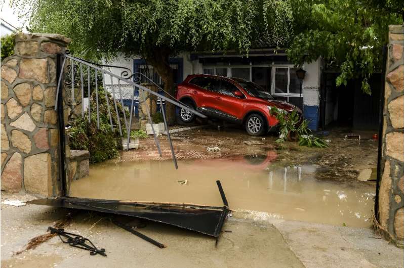 A car stranded in a garden in Aldea del Fresno, near Madrid