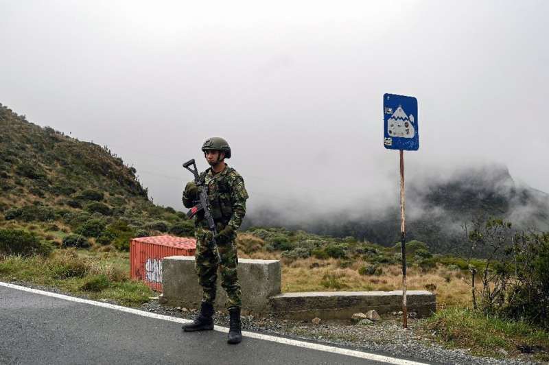 A Colombian soldier stands guard near the Nevado del Ruiz volcano