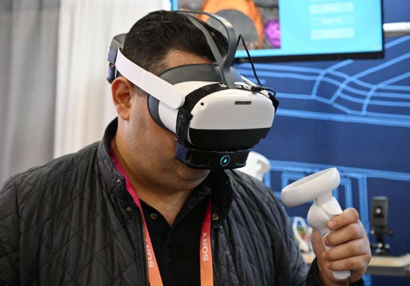 A man at CES tries out OVR Technology's ION 3, which emits smells when a user interacts with items a VR environment