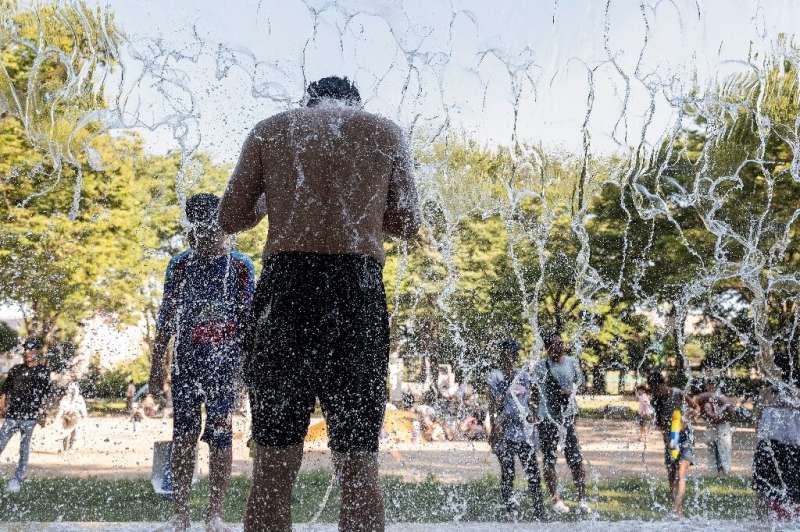 A man cools off at a park in eastern Tokyo