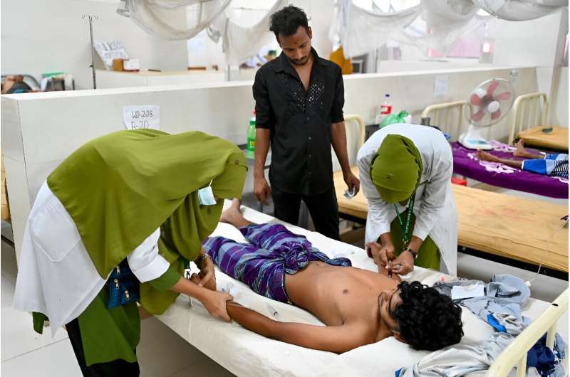 A man receives treatment for dengue fever at the Shaheed Suhrawardy Medical College Hospital in Dhaka on October 2, 2023