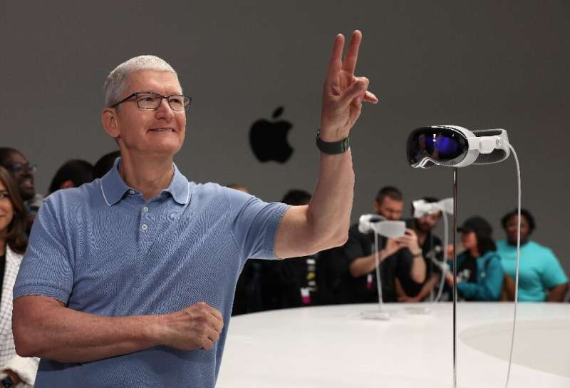 A new Apple Vision Pro mixed reality headset shown off by chief executive Tim Cook is so packed with technology that it plugs in
