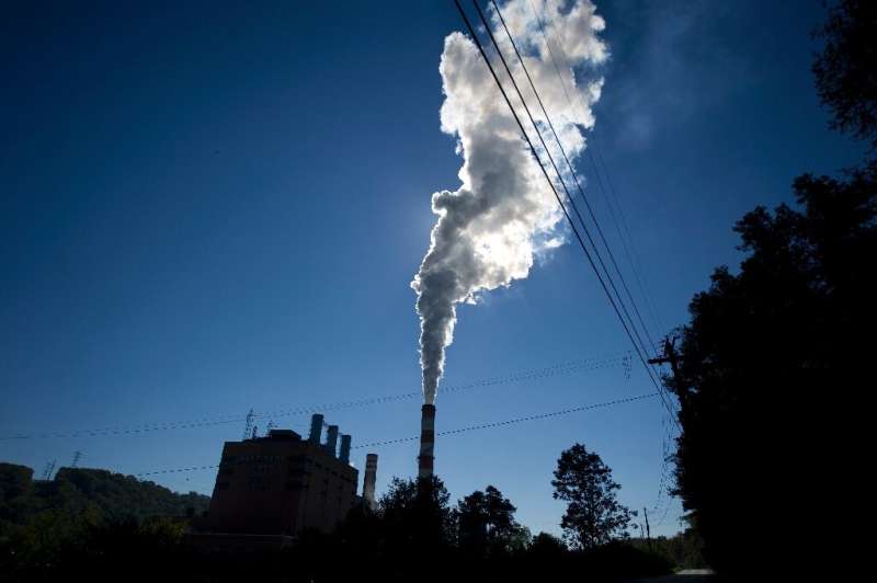 A plume of exhaust extends from the Mitchell Power Station, a coal-fired power plant located 20 miles southwest of Pittsburgh, i
