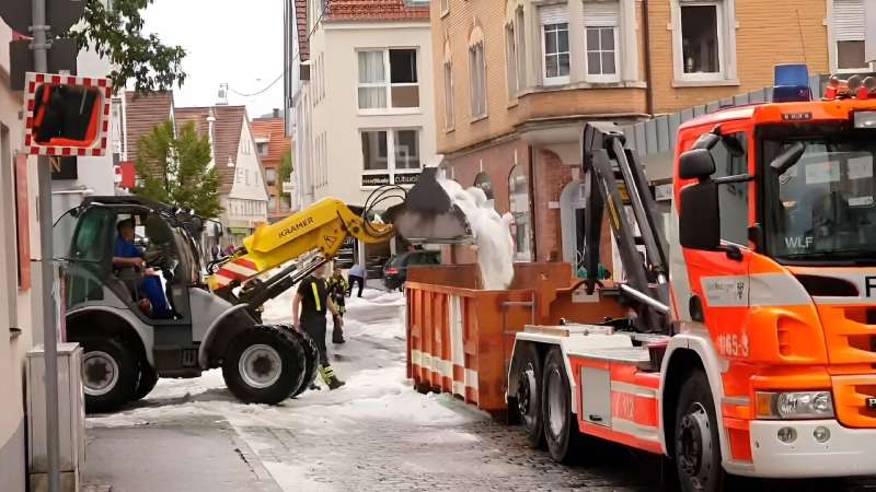 A snowplow picks up hail on the streets in Reutlingen, southern Germany on August 4, 2023