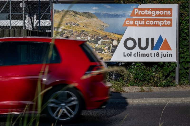 A Swiss election poster reading 'Protect what counts. Yes to June 18 Climate Law'