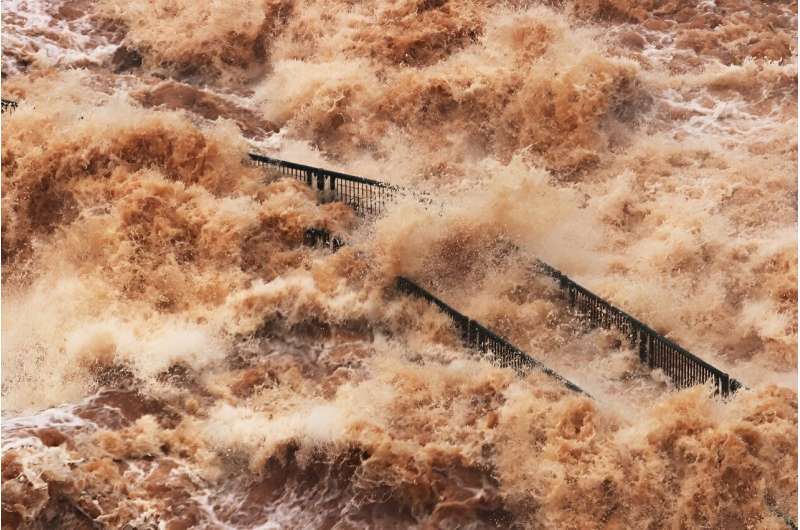 A tourist walkway at Iguazu falls between Argentina and Brazil is engulfed by flood waters after storms swelled the falls to near decade-high water levels