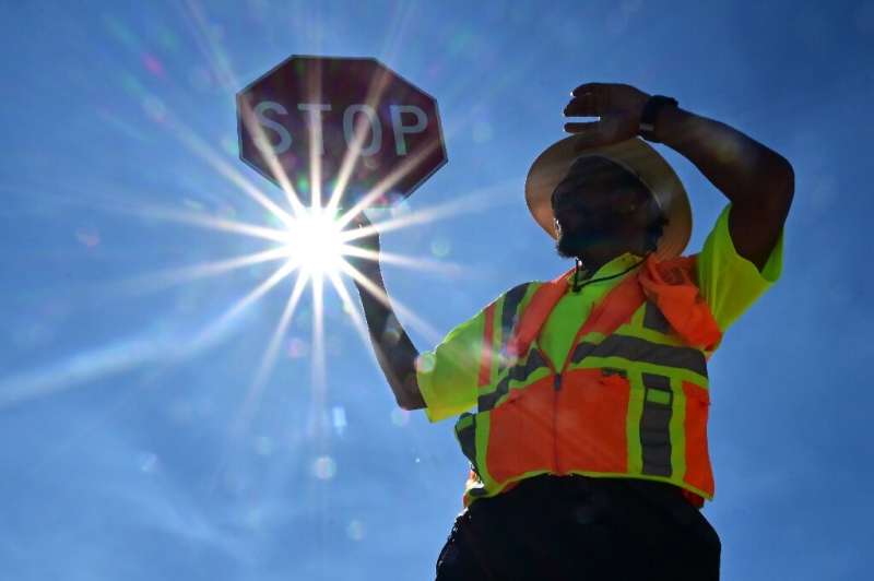 A traffic warden in Las Vegas mans his street corner in searing heat in Las Vegas, Nevada