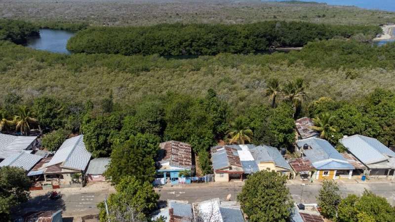 Aerial view of the houses located on the construction line of the anti-migrant wall, in Pepillo Salcedo, Dominican Republic on M