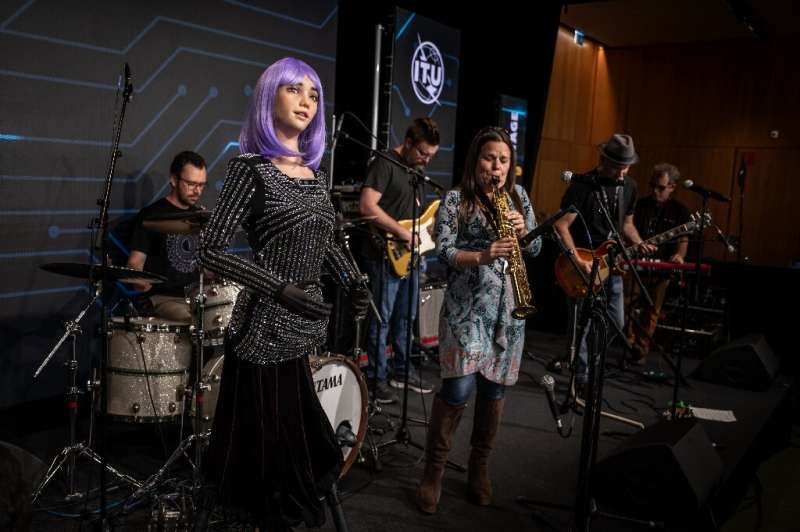AI robot singer Desdemona performs with the Jam Galaxy Band, who interact with her lyrics