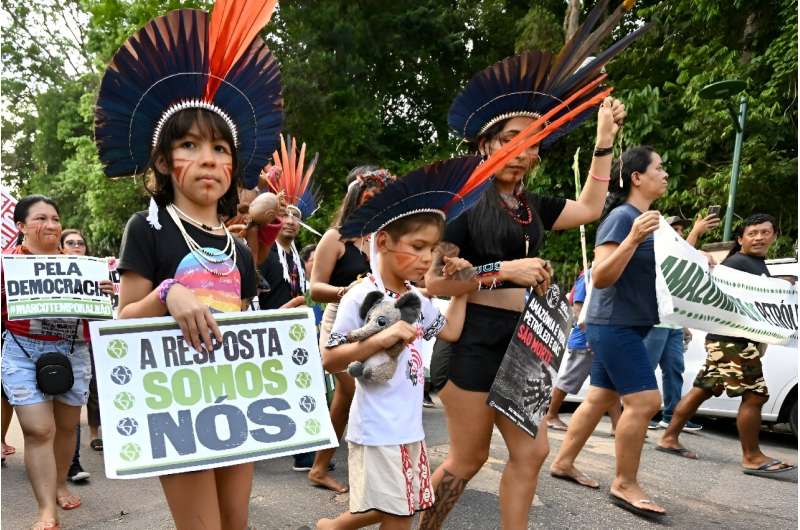 Amazon Indigenous activists and climate campaigners demonstrate on the sidelines of a summit in Belem, Brazil on saving the worl