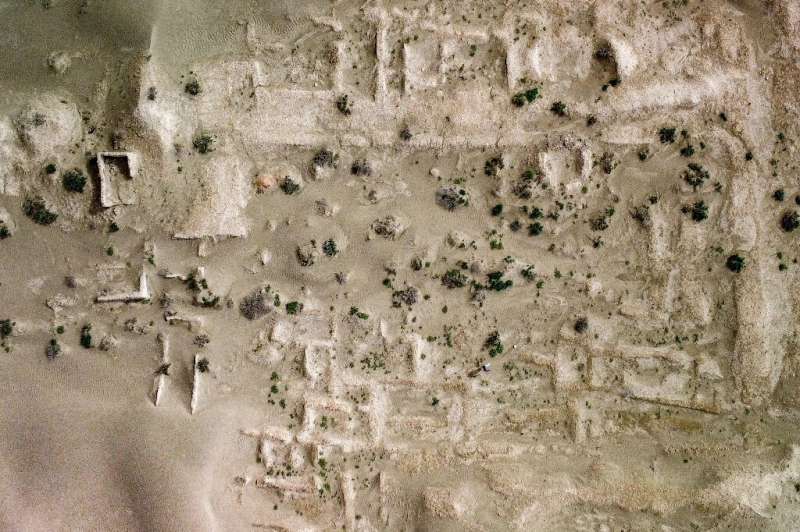 An aerial view of an ancient structure at the Umm al-Aqarib archaeological site, which is frequently buried by sandstorms due to