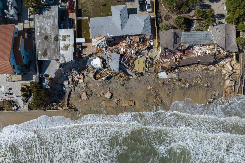 An aerial view of destroyed beachfront homes in the aftermath of Hurricane Nicole at Daytona Beach, Florida, on November 11, 202