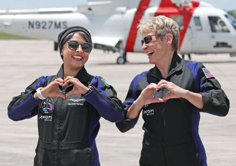 Axiom Mission 2 specialist Rayyanah Barnawi (L) of Saudi Arabia and commander and former NASA astronaut Peggy Whitson, of the Un