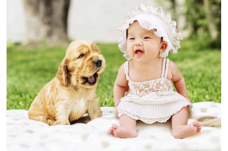 baby and puppy