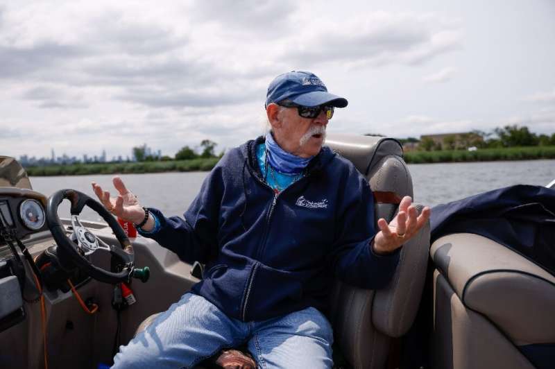 Bill Sheehan, who became an activist after observing the dire situation of the Hackensack River, drives his boat in Secaucus, Ne