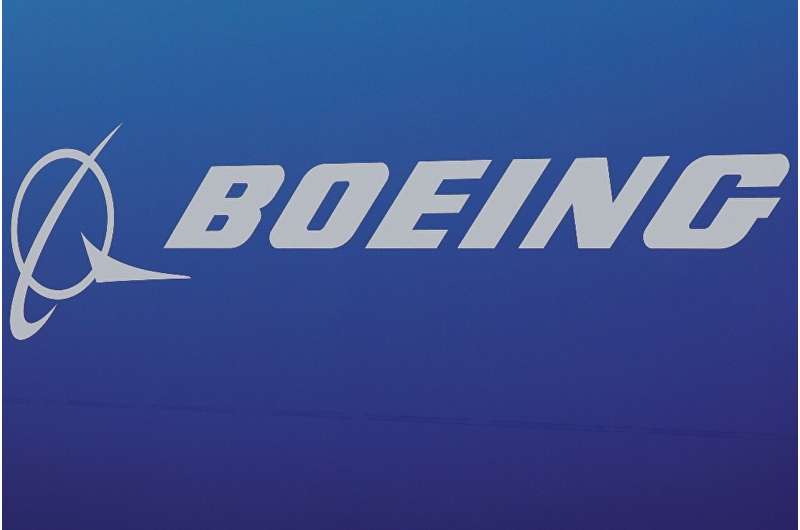 Boeing reported a quarterly loss but lifted production rates on key commercial plane models