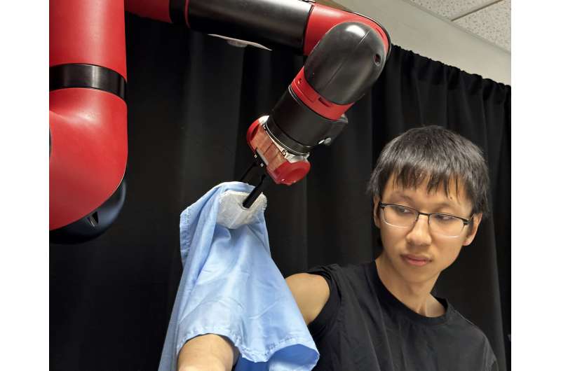 Carnegie Mellon University robot puts on shirts one sleeve at a time