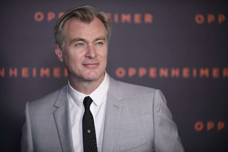 Christopher Nolan says the story of the invention of the atomic bomb told in his new film &quot;Oppenheimer&quot; is a warning t