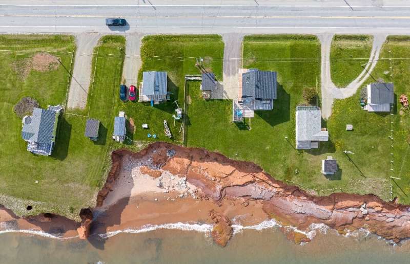 Coastal erosion around waterfront homes on the Magdalen islands of Quebec, Canada, highlight the extent of climate change impact