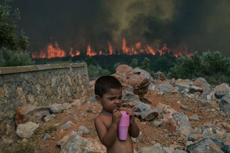 Crews are battling wildfires in heatwave-hit Greece