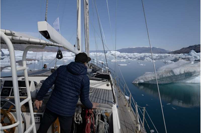 David Delample, captain of the &quot;Kamak&quot;, as the ship navigates icebergs in Scoresby Fjord