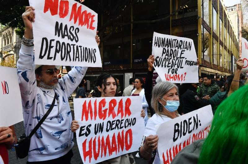 Demonstrators protest against mass deportations at a rally near the National Palace in Mexico City