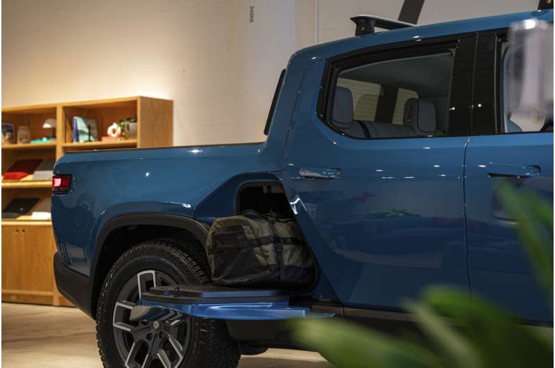 Electric truck maker Rivian says construction on 1st phase of Georgia factory will proceed in 2024