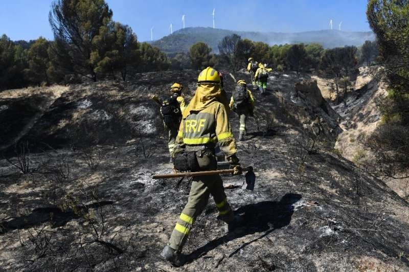 Firefighters put out a wildfire in the Moncayo Natural Park in the northern region of Aragon on August 15 last year.