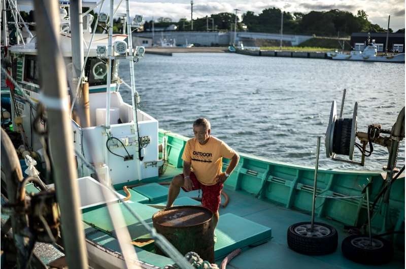 Fisherman Haruo Ono stands on one of his fishing boats. Japan's government will decide on Tuesday about the release of treated w