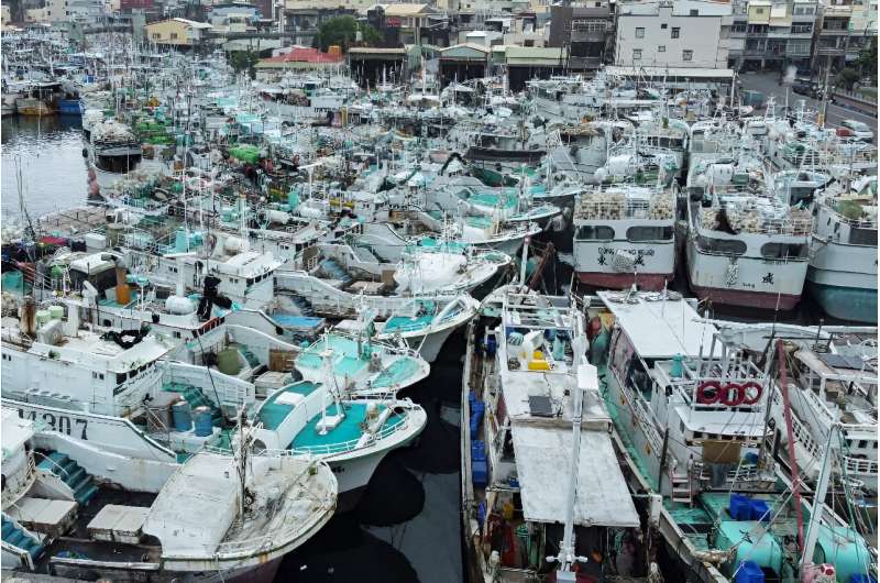 Fishing boats were crammed into a fishing habour in Taiwan's Pingtung county ahead of Typhoon Koinu's expected landfall