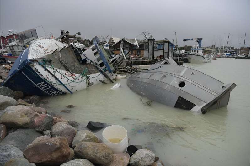 Fishing boats were left stranded or about to sink in the town of Rodvig