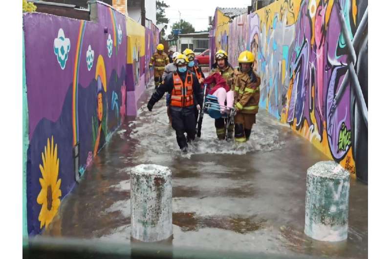 Floods triggered by the cyclone have forced thousands from their homes in southern Brazil
