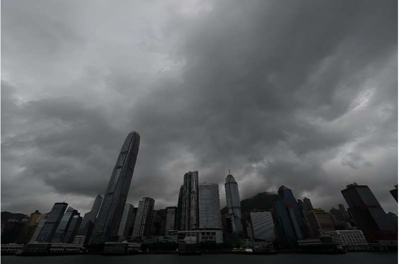 Heavy rain clouds are seen over Hong Kong on October 8, 2023