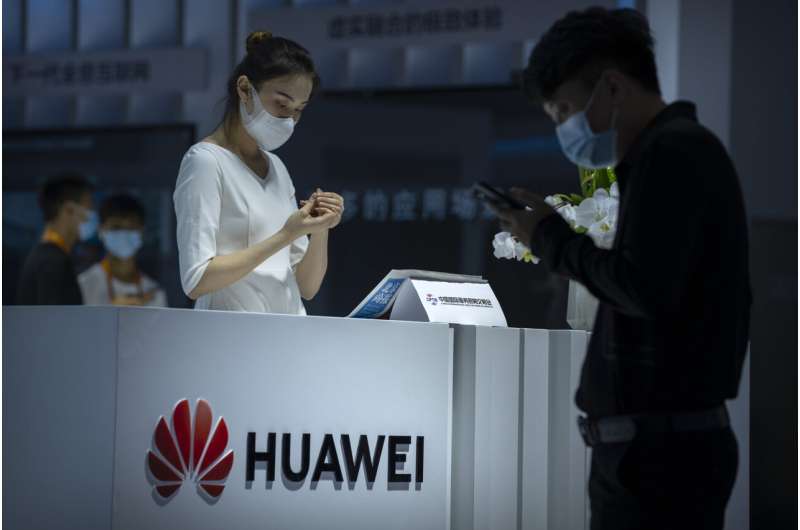Huawei profit sinks in 2022 amid sanctions but sales higher