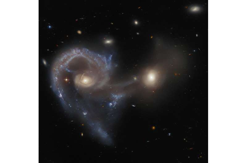 Hubble Peers at peculiar Arp 107 pair