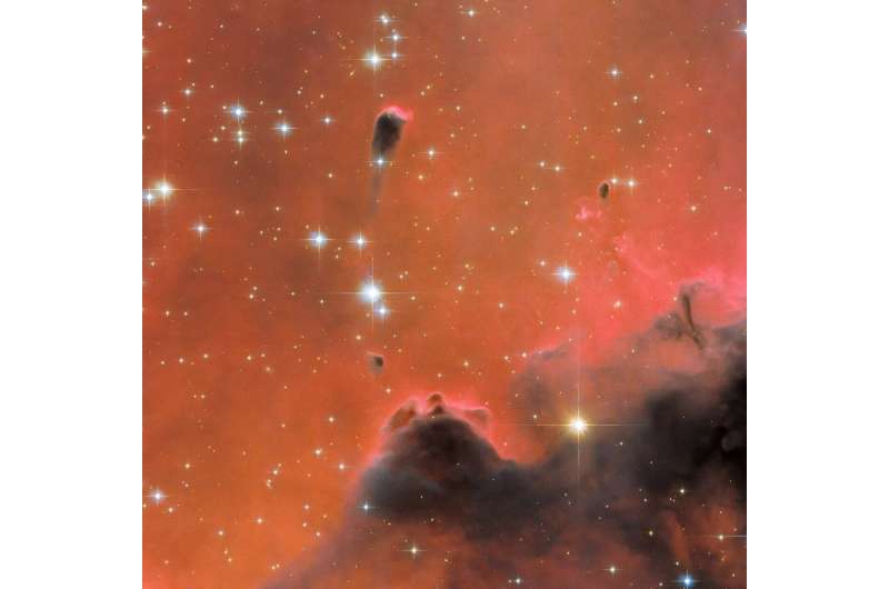 Hubble Views a Glistening Red Nebula