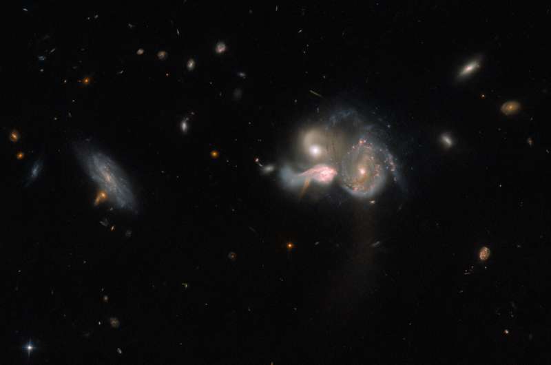 Hubble Views a Merging Galactic Trio