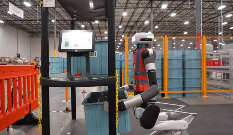 Humanoid robot working in a Spanx warehouse