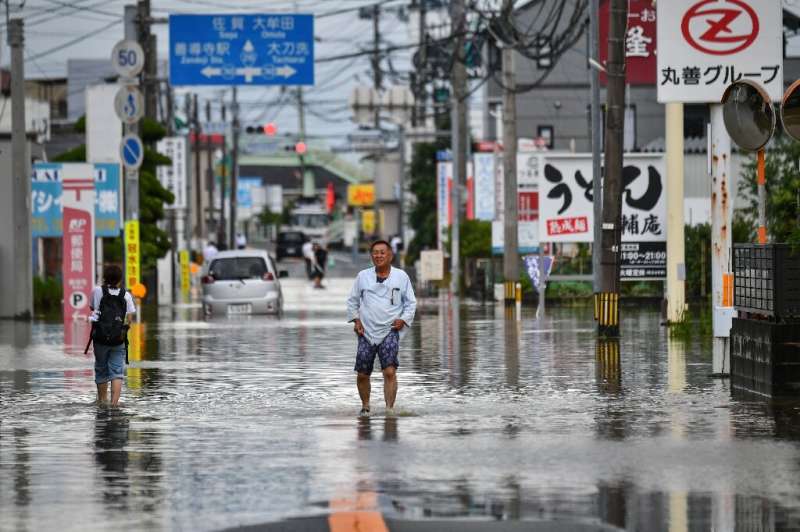 Hundreds of thousands of people have been urged to leave their homes in southwestern Japan over the rains