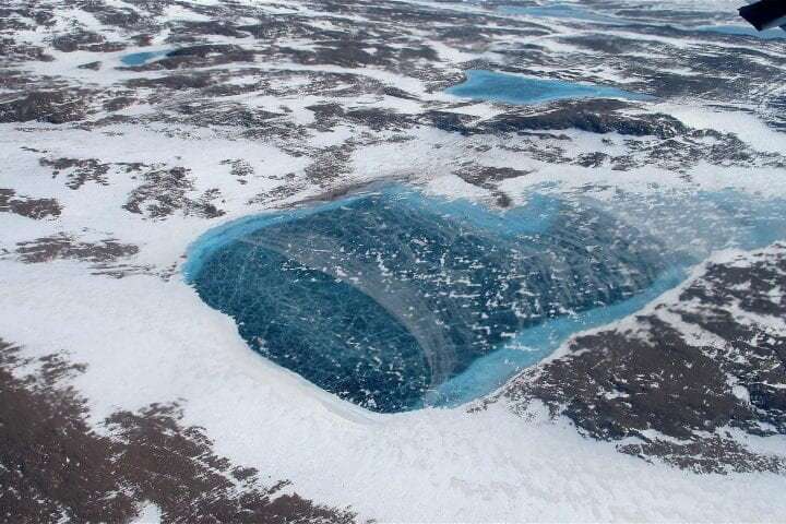 Ice sheet surface melt is accelerating in Greenland and slowing in Antarctica