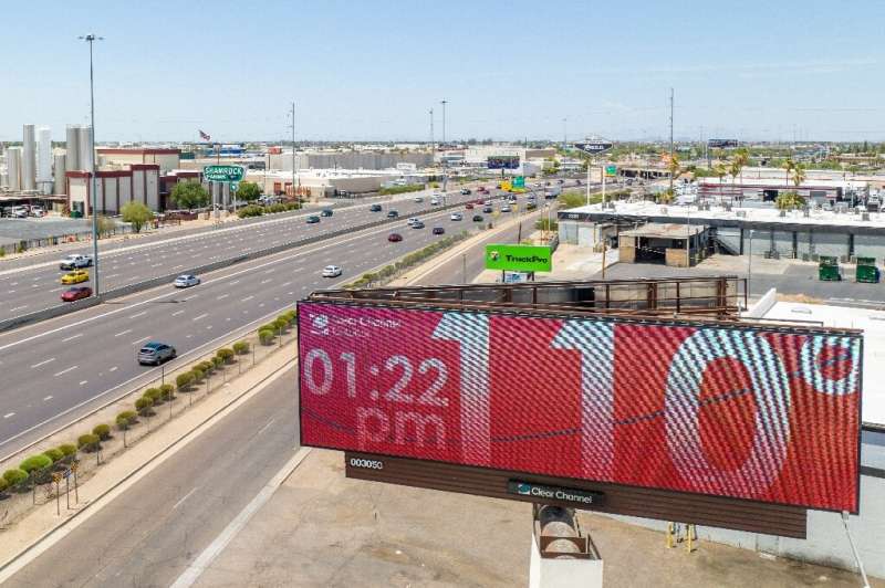 In the aerial view, the billboard shows the temperature predicted to reach 115 degrees Fahrenheit on July 16, 2023 in Ph